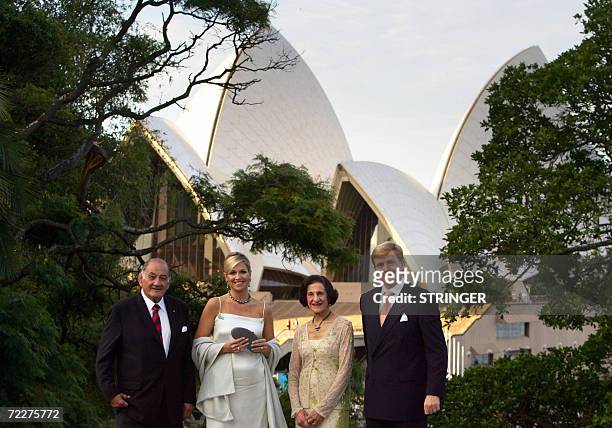 Crown Prince Willem-Alexander of Orange and Princess Maxima of the Netherlands stand in front of the Sydney Opera House with the Governor of New...