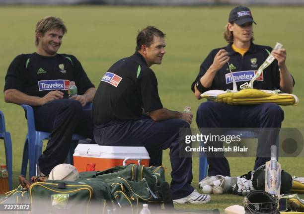 Australian cricket captain Ricky Ponting of Australia relaxes with team mates Shane Watson and Nathan Bracken during training at the Chandigarh...