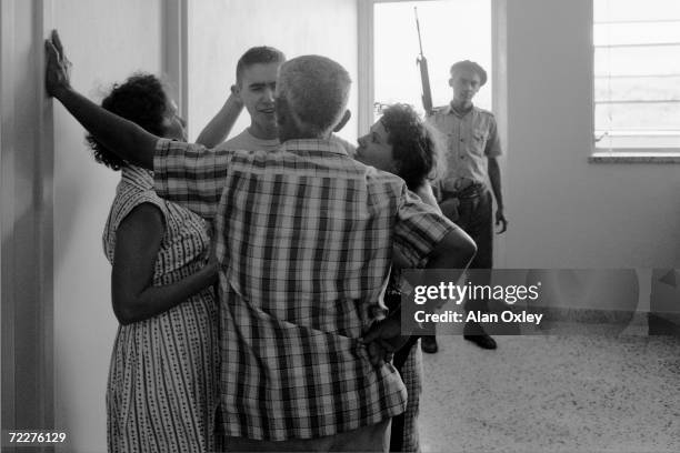 Overcome with emotion, a young POW captured by Castro forces in the Bay Of Pigs Invasion meets his family at the naval hospital where he is being...
