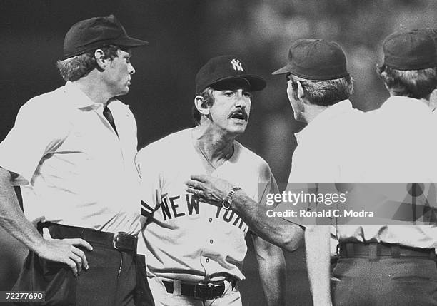 Manager Billy Martin of the New York Yankees argues with umpires during a game against the Milwaukee Brewers at at County Stadium in the late 1970s...