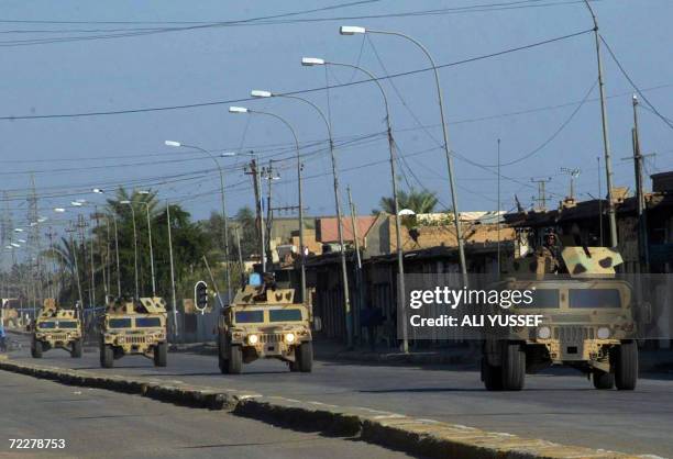 Iraqi security forces driving in up-armored US made Humvees patrol the street of the restive city of Baquba, 60 kms northeast of Baghdad, 27 October...