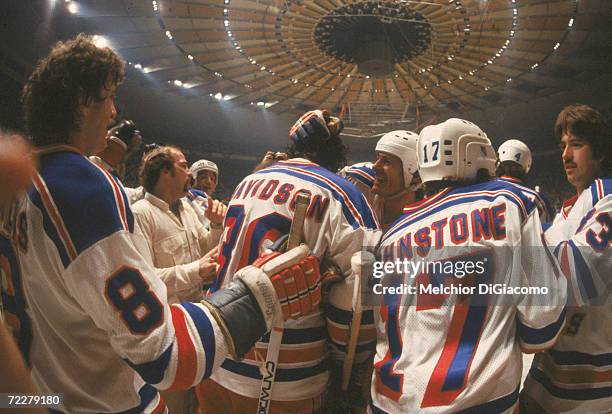 The New York Rangers celebrate their playoff victory over the New York Islanders on the ice at Madison Square Garden, New York, New York, 1979....