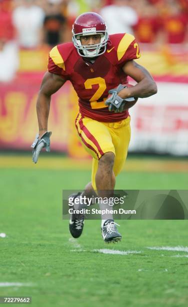Wide receiver Steve Smith of the USC Trojans carries the ball against the Arizona State Sun Devils at the Los Angeles Memorial Coliseum on October...