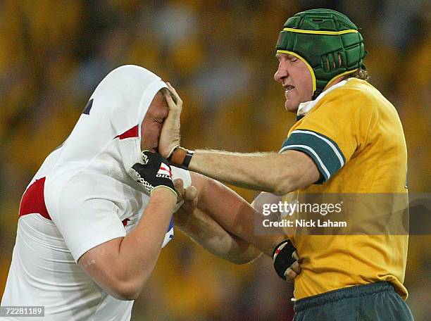 Justin Harrison of the Wallabies hits Steve Thompson of England in the face during the rugby union international match between the Australian...