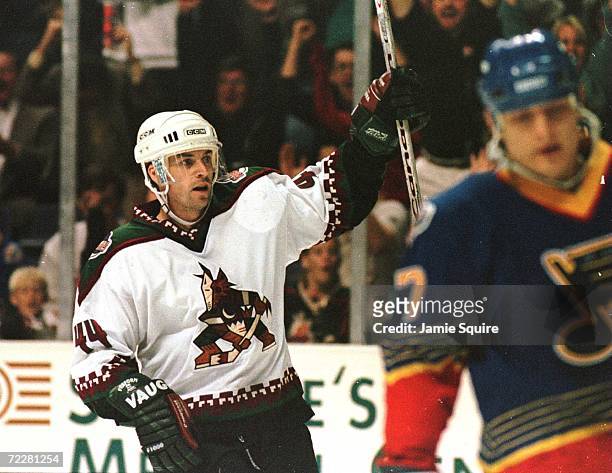 Norm Maciver of the Phoenix Coyotes raises his hand in celebration as he gestures to the crowd after scoring a goal during a line shift in the second...