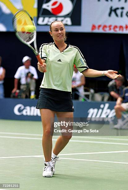 Tennis star Martina Hingis plays a match August 26, 2000 against Arantxa Sanchez-Vicario at the Arthur Ashe Kid's Day Family and Music Festival...