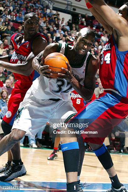 Joe Smith of the Minnesota Timberwolves attempts to go to the basket but is stoped by Michael Olowokandi of the Los Angeles Clippers at Target Center...