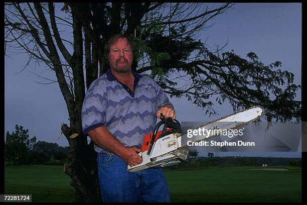 Craig Stadler poses with chainsaw at Torrey Pines Golf Course in San Diego, California. Mandatory Credit: Stephen Dunn /Allsport