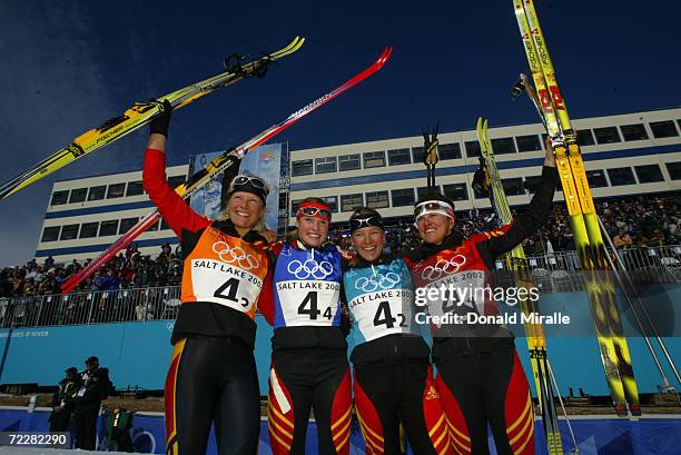 Team Germany - Claudia Kuenzel, Evi Sachenbacher, Viola Bauer and Manuela Henkel celebrate gold in the Women's 4x5km Cross Country Relay at Soldier...