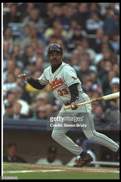 First baseman Eddie Murray of the Baltimore Orioles watches the ball fly during a playoff game against the New York Yankees at Yankee Stadium in New...