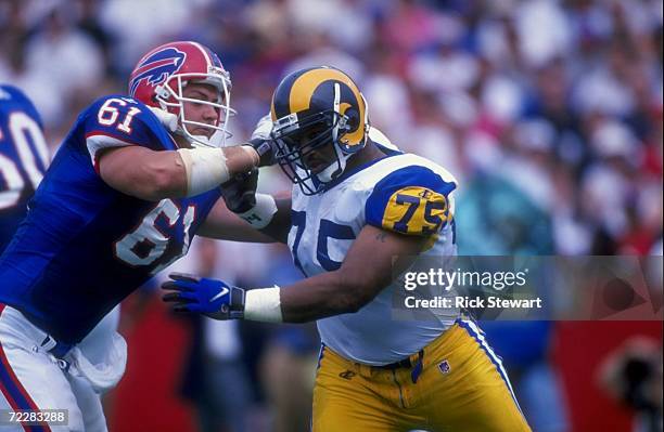 Defensive tackle D''Marco Farr of the St. Louis Rams is blocked by Tom Nutten of the Buffalo Bills during a game at the Bills Stadium in Orchard...