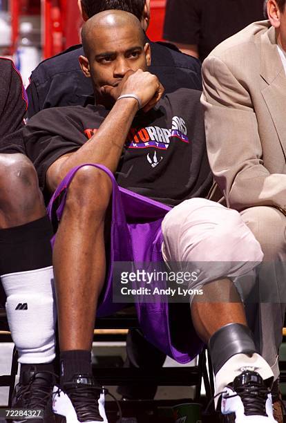 Vince Carter of the Toronto Raptors sits on the bench with ice on his knee that he injured during the second quarter of the Raptors v Magic NBA game...