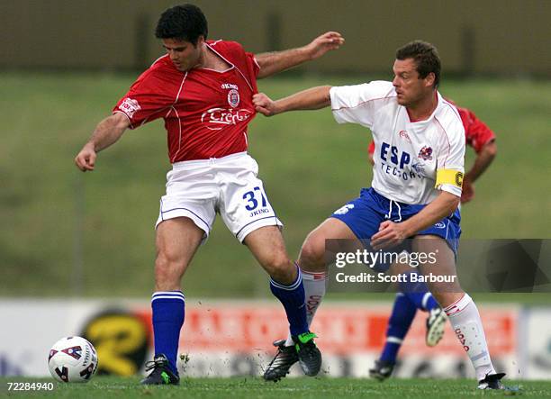 Aljosa Asanovic of Sydney United is tackled by Andrew Marth of the Knights during the round 9 NSL match between Sydney United and Melbourne Knights...