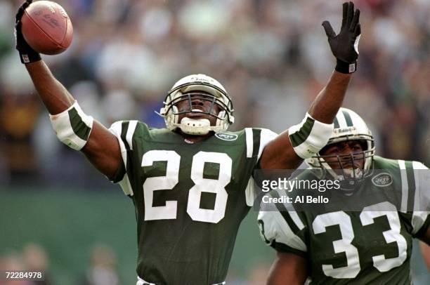 Curtis Martin of the New York Jets celebrates as he after he makes a touchdown during the game against the Seattle Seahawks at the Giants Stadium in...