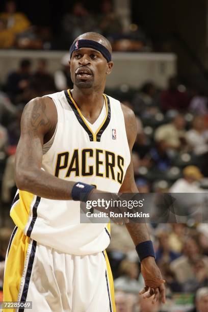 Stephen Jackson of the Indiana Pacers stands on the court with a taped lip during the preseason game against the Utah Jazz at Conseco Fieldhouse on...