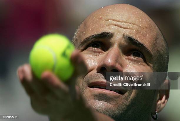 Andre Agassi of the U.S. Serves against Nicolas Massu of Chile during day one of the 2005 Kooyong Classic at Kooyong Lawn Tennis Club January 12,...