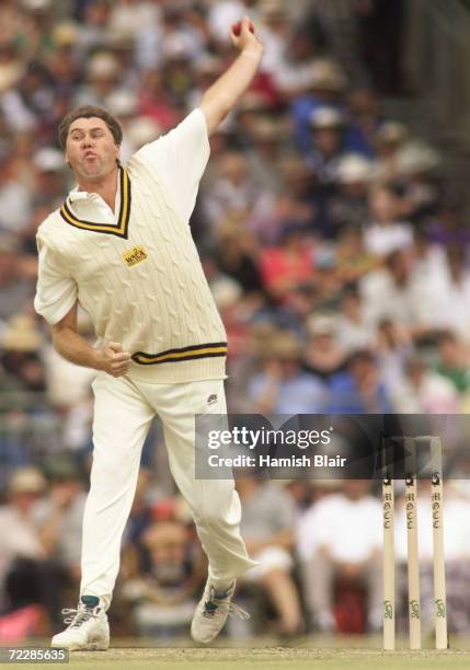 Bruce Reid of the Chairman's XI sends down a delivery, during the One Day Match between the Australian Cricket Board Chairman's XI and South Africa...