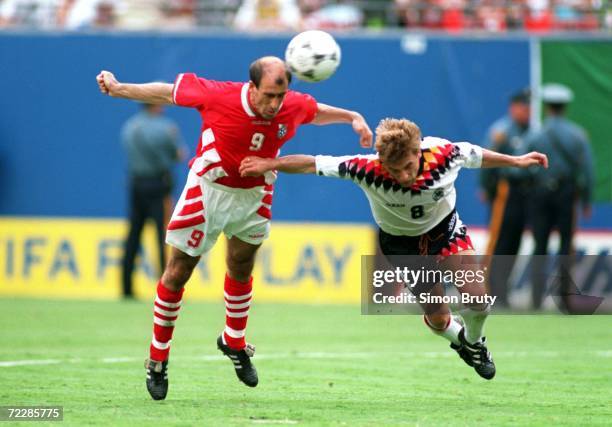 IORDAN LETCHKOV OF BULGARIA BEATS THOMAS HASSLER OF GERMANY WITH A HEADER TO SCORE THE WINNING GOAL DURING ITS 2-1 VICTORY OVER GERMANY IN THE...