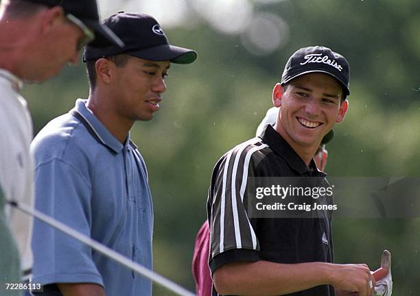 Sergio Garcia smiles at Tiger Woods as they walk together during the PGA Championships at the Medinah Country Club in Medinah, Illinois.