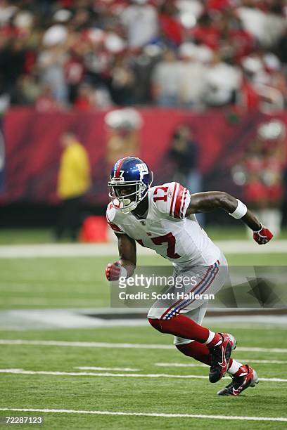Wide receiver Plaxico Burress of the New York Giants runs downfield against the Atlanta Falcons at the Georgia Dome on October 15, 2006 in Atlanta,...