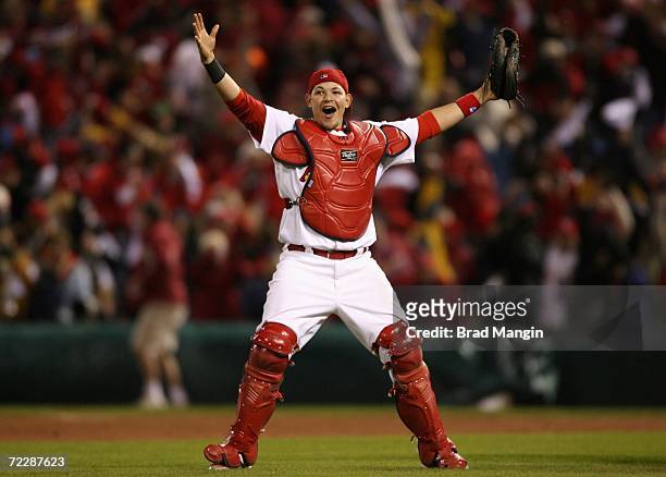 Catcher Yadier Molina of the St. Louis Cardinals celebrates on the field after defeating the Detroit Tigers in Game Five of the 2006 World Series on...