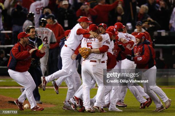 Scott Rolen and Albert Pujols of the St. Louis Cardinals celebrates after defeating the Detroit Tigers in Game Five of the 2006 World Series on...