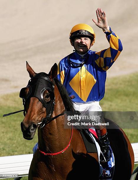 Craig Williams salutes the crowd after riding Fields Of Omagh to victory in the Tattersall's W. S. Cox Plate during the Cox Plate meeting at Moonee...