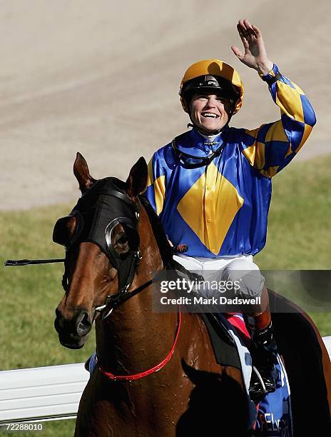 Craig Williams salutes the crowd after riding Fields Of Omagh to victory in the Tattersall's W. S. Cox Plate during the Cox Plate meeting at Moonee...