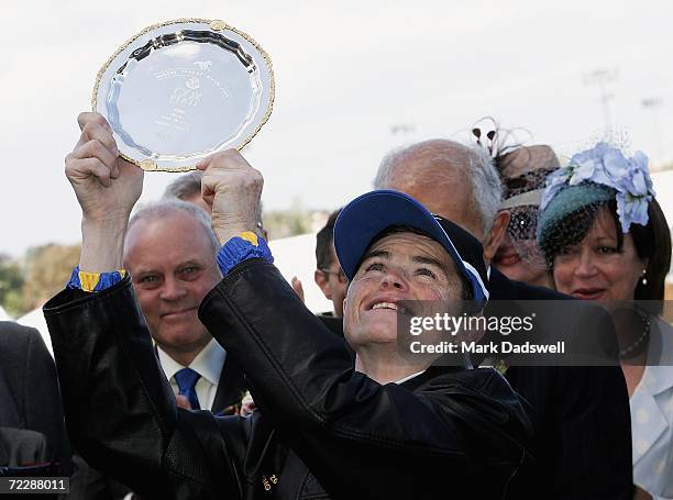 Jockey Craig Williams looks skywards after being presented with his trophy for riding Fields Of Omagh to victory in the Tattersall's W. S. Cox Plate...