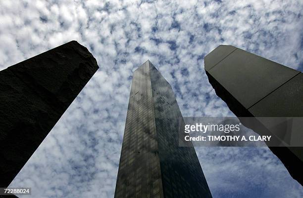 New York, UNITED STATES: Rain clouds move into the New York City sky 27 October 2006, as a background to the Trump World Tower and columns made of...