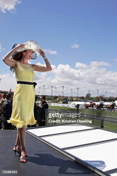 Actress Jolene Anderson watches a race during "Fashions on the Field" competition during the Cox Plate meeting at Moonee Valley Racing Club on...