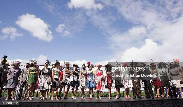 Competitors line up for the judges at the "Fashions on the Field" competition during the Cox Plate meeting at Moonee Valley Racing Club on October...