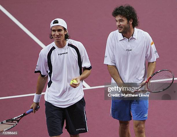 Juan Ignacio Chela and Jose Acasuso of Argentina in action against Mark Knowles of the Bahamas and Daniel Nestor of Canada during day five of the ATP...