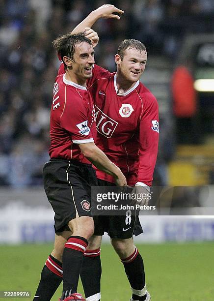 Gary Neville and Wayne Rooney of Manchester United celebrate after Cristiano Ronaldo scores the third goal during the Barclays Premiership match...