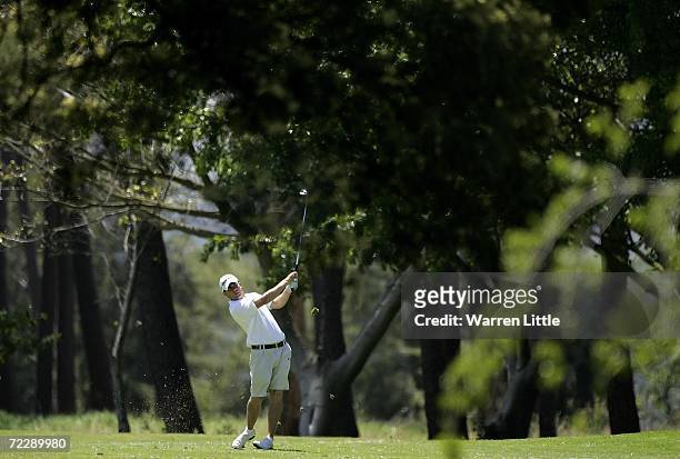 Richie Ramsay of Scotland plays his second shot into the 10th green during the third round of the Eisenhower Trophy at Stellenbosch Golf Club on...