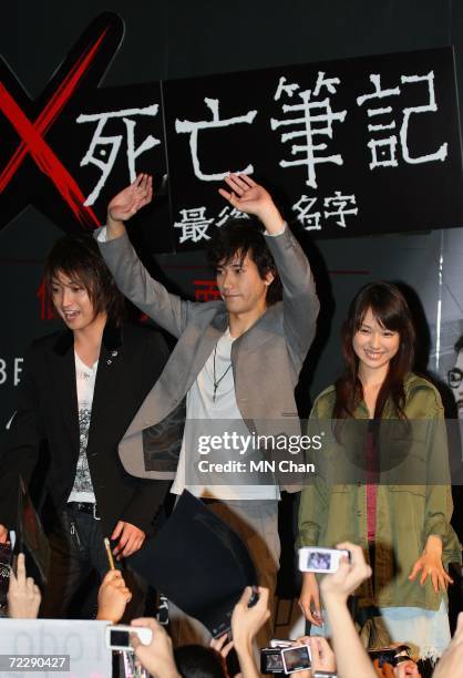 Japanese actors Tatsuya Fujiwara, Kenichi Matsuyama and Erika Toda greet their fans during a promotion of their new movie " Death Note: The Last Name...