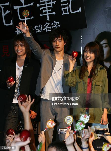 Japanese actors Tatsuya Fujiwara, Kenichi Matsuyama and Erika Toda greet their fans during a promotion of their new movie " Death Note: The Last Name...