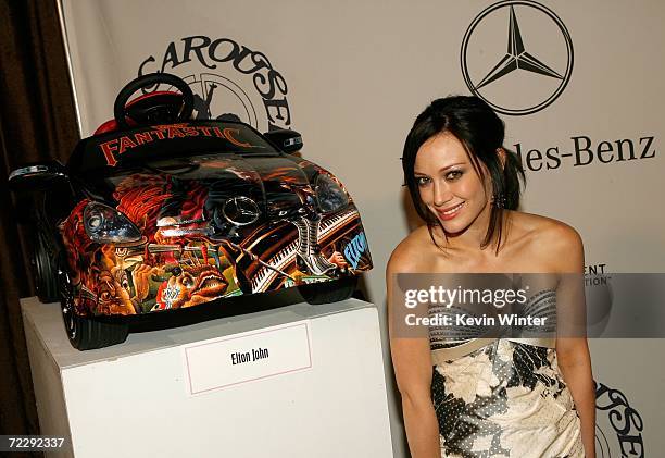 Singer/actress Hilary Duff poses next to the toy pedal car at the 17th Annual Mercedes-Benz Carousel of Hope cocktail party at the Beverly Hilton...