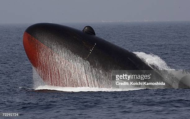Japanese Maritime Self-Defense Force submarine surfaces during a naval fleet review on October 29, 2006 off Sagami Bay, Japan. Prime Minister Shinzo...