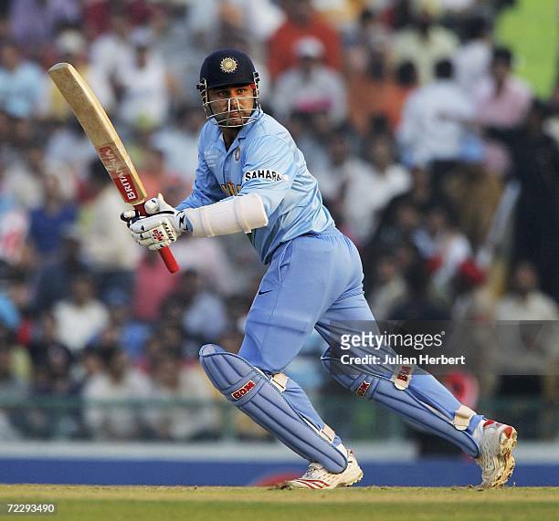 Virenda Sehwag of India in action against the Australian attack during the ICC Champions Trophy match between Austalia and India at The Punjab...