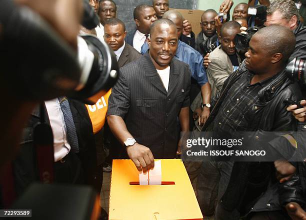 Kinshasa, Democratic Republic of the Congo: Democratic Republic of Congo's incumbent President Joseph Kabila casts his vote in a polling station in...