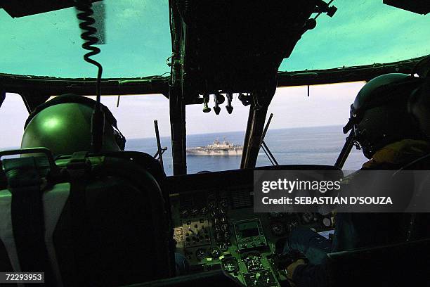 An Indian helicopter approches the American ship USS Boxer LHD 4 during the ninth Indo-US joint excercise 'Malabar-2006' in the Arabian Sea off the...