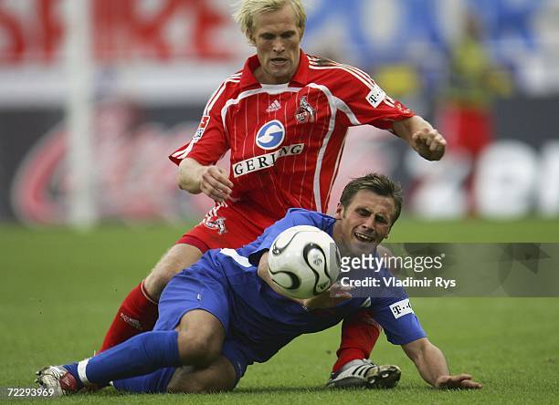 Pekka Lagerblom of Cologne and Marcel Schied of Rostock battle for the ball during the Second Bundesliga match between 1.FC Cologne and Hansa Rostock...