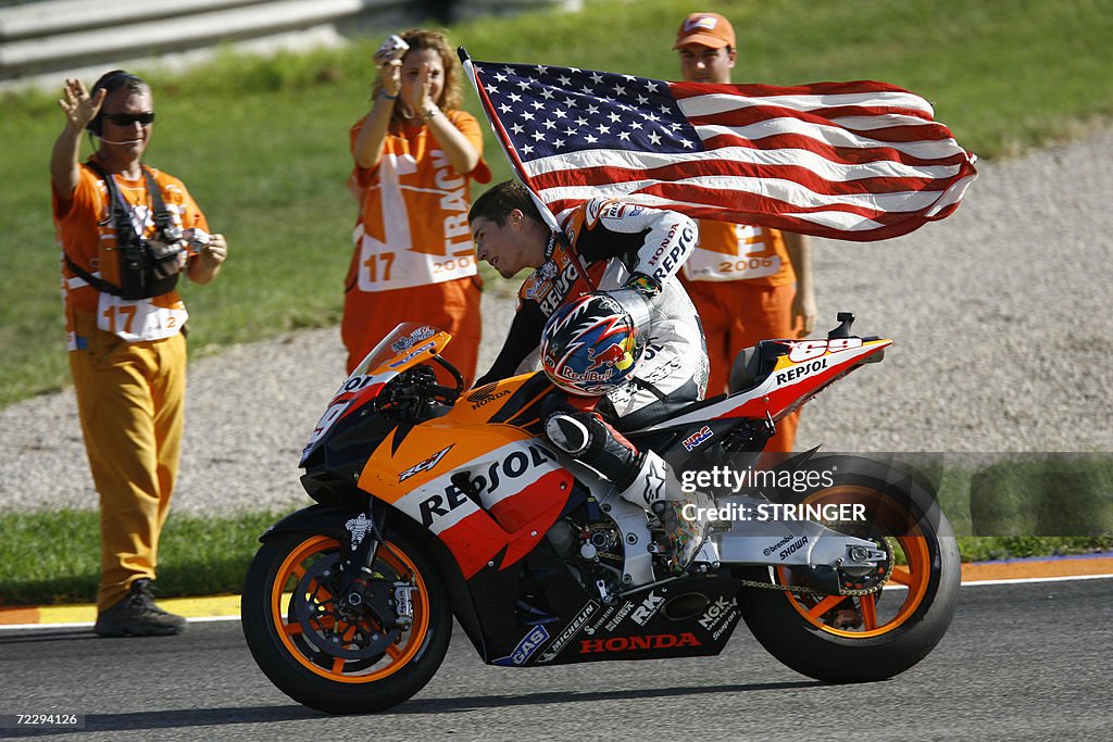 US Nicky Hayden does a victory lap after