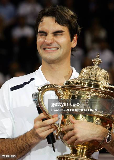 Swiss Roger Federer holds his trophy after winning his final against Chile's Fernando Gonzales at the Swiss Indoors ATP tennis tournament, 29 October...