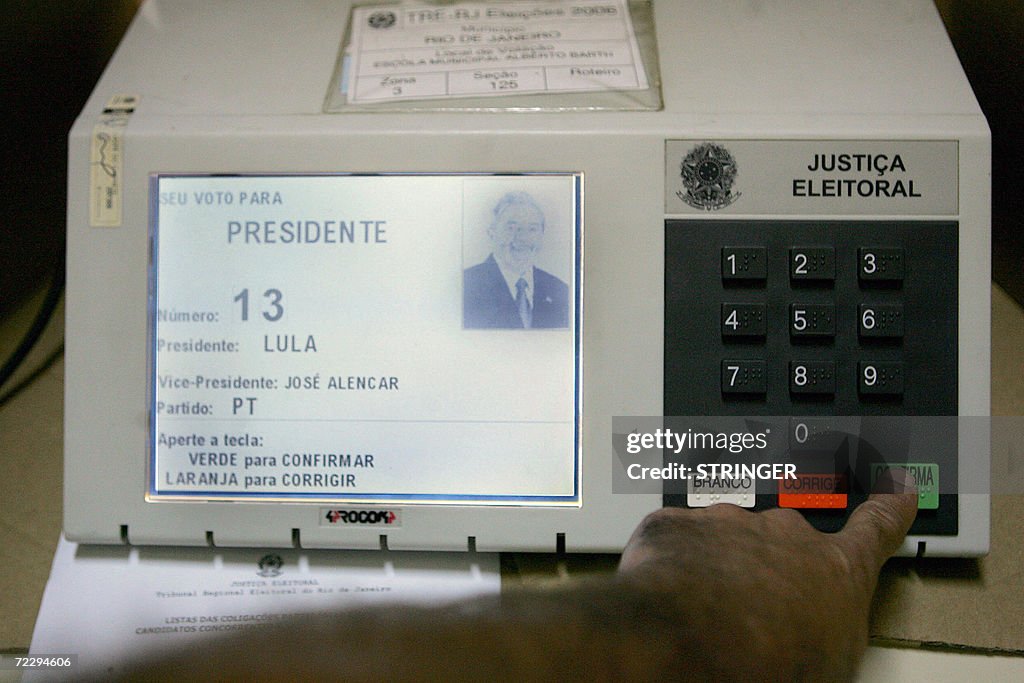 A man votes in an electronic machine dur