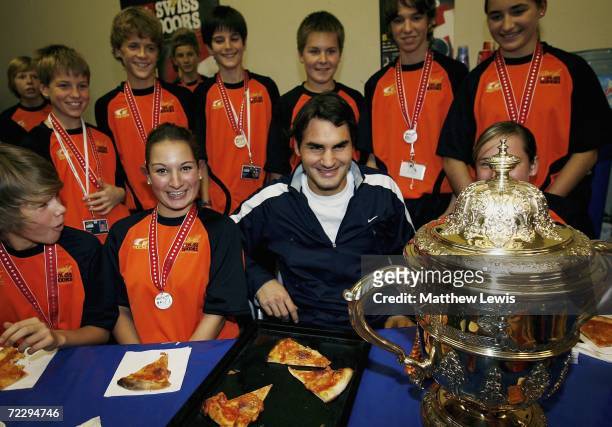 Roger Federer of Switzerland pictured with the ball children after winning the mens final of the ATP Davidoff Swiss Indoors Tournament at...