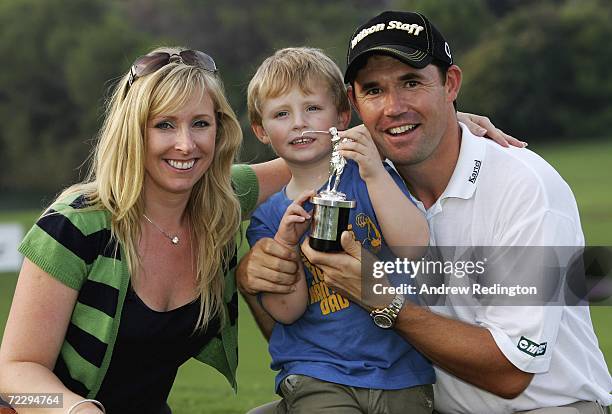 Padraig Harrington of Ireland poses with the Vardon Trophy alongside his wife Caroline and son Patrick after winning The Order of Merit at the Volvo...