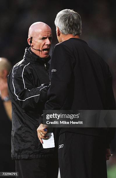 Alan Pardew manager of West Ham United is spoken to by fourth official Dermot Gallagher during the Barclays Premiership match between West Ham United...