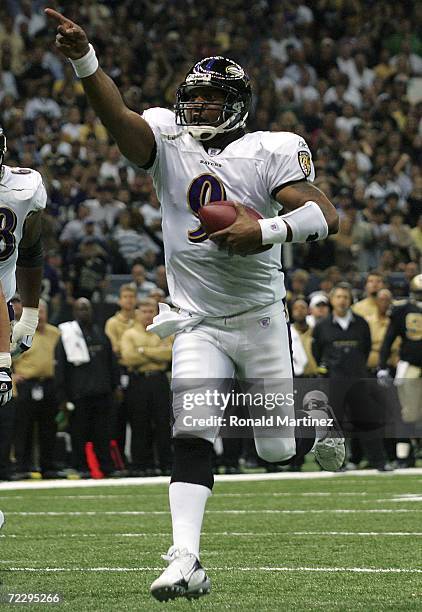 Quarterback Steve McNair of the Baltimore Ravens celebrates while running for a touchdown against the New Orleans Saints at the Louisiana Superdome...